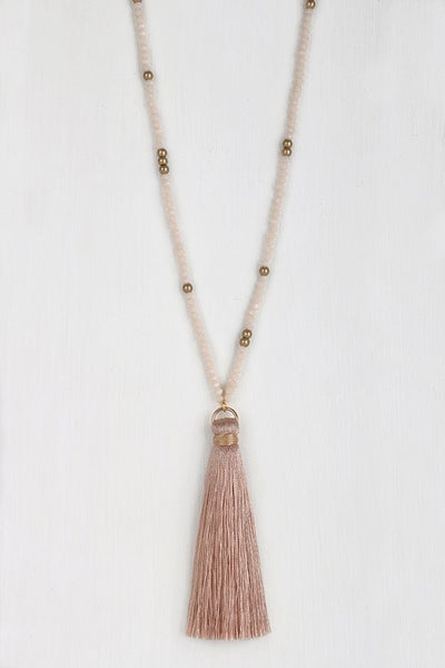 This lovely mixed glass necklace is brought to you by Urbanista. It is 32" long with a 3" extender and features a fine thread tassel pendant.