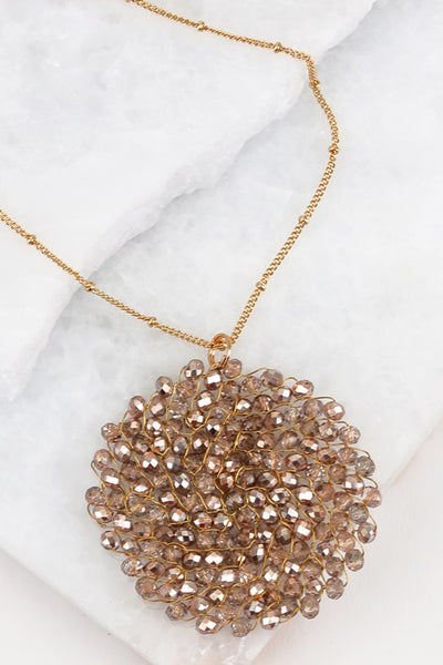 This 32 inch intricate crystal wire link beaded pendant long necklace by Urbanista adds the right bling to any top or dress. Now available in Black, Rose Gold, Black Diamond,Hematite, Bronze, Matte Gold, and Ivory!