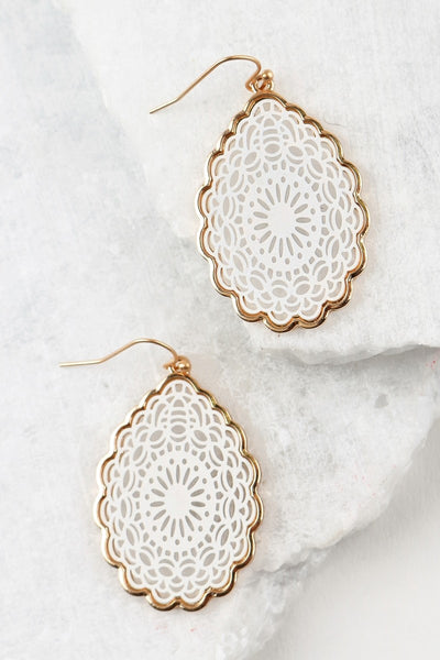 Perfect for your white summer outfit! These white filigree tear drop earrings have a scalloped gold edging. They are 2 inches long and 1 inch wide.