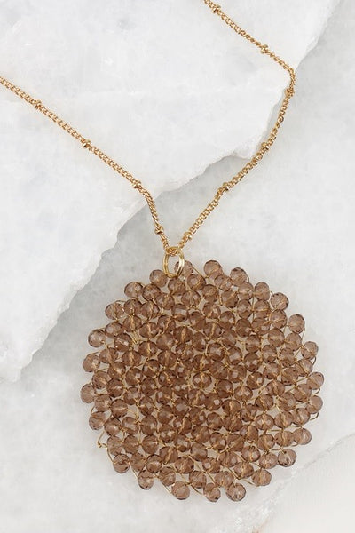 This 32 inch intricate crystal wire link beaded pendant long necklace by Urbanista adds the right bling to any top or dress. Now available in Black, Rose Gold, Black Diamond,Hematite, Bronze, Matte Gold, and Ivory!