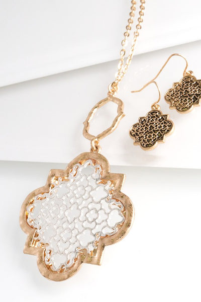 You can't go wrong with this lovely quatrefoil filigree necklace from Urbanista. It is 30" long with a 3" extender and comes in Gold/Silver, Silver, and Gold.