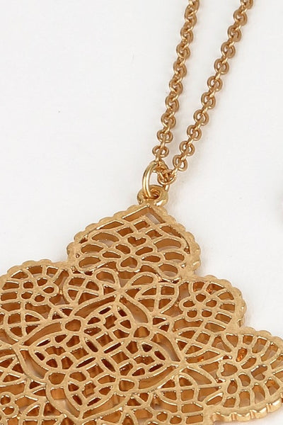 This 32" filigree marquee flower pendant necklace will make a fine addition to your accessory collection. Comes in gold and silver.