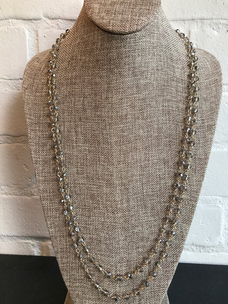You will want to toast this 60 inch glass champagne link necklace. It's versatile and a great choice for a subtle look. Wear it long or wrapped.