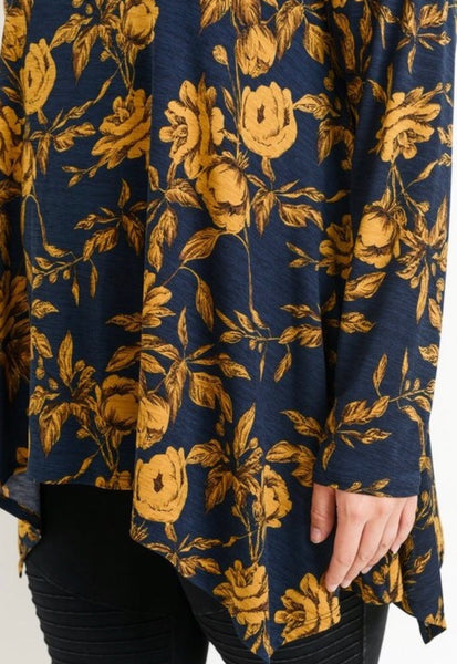 This is absolutely one of our favorite fabrics! This long sleeve round neckline top by JODIFL has a asymmetrical hem that covers all of the parts that need to be covered! The fabric is 100% polyester and just gorgeous. Available in 1X- 3X.