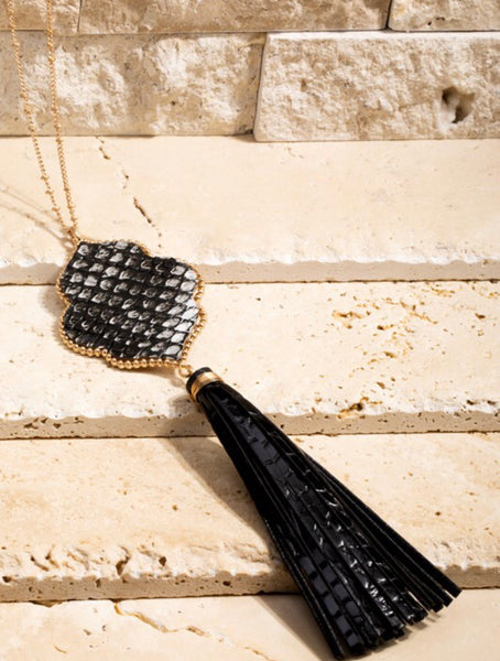 This long 26 1/2 inch necklace has a beautiful 6 1/2 inch faux snake and faux leather tassel that will look great with any MRB top or dress. Matching earrings are included. Comes in Black and Leopard.