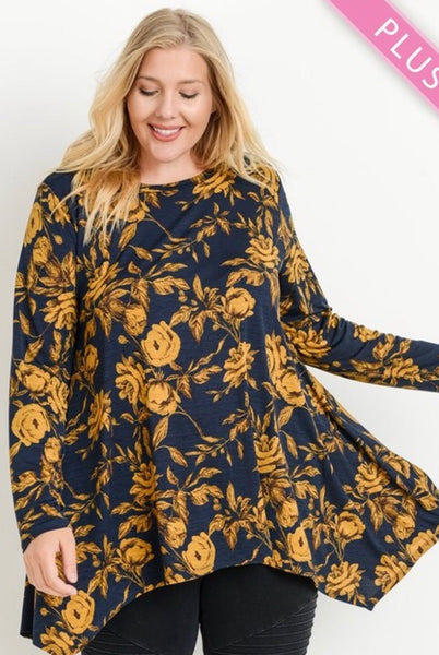 This is absolutely one of our favorite fabrics! This long sleeve round neckline top by JODIFL has a asymmetrical hem that covers all of the parts that need to be covered! The fabric is 100% polyester and just gorgeous. Available in 1X- 3X.