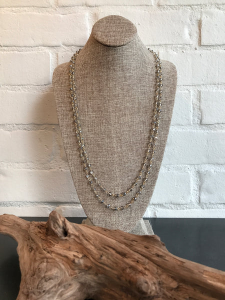 You will want to toast this 60 inch glass champagne link necklace. It's versatile and a great choice for a subtle look. Wear it long or wrapped.