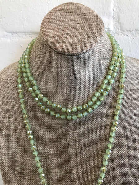 So in and so versatile! This light sage green necklace is 72 inches long and best of all....hand knotted with matching thread. The crystal beads are faceted giving this necklace sparkle. Wear it long, wrap it once for choker look or even three times! This will be one you wear over and over.