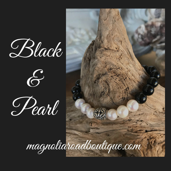 So sweet and feminine! This custom has natural pink shell beads and freshwater pearls. It's 7 inches in diameter. Great for layering with a pearl bracelet.