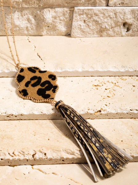 This long 26 1/2 inch necklace has a beautiful 6 1/2 inch faux snake and faux leather tassel that will look great with any MRB top or dress. Matching earrings are included. Comes in Black and Leopard.