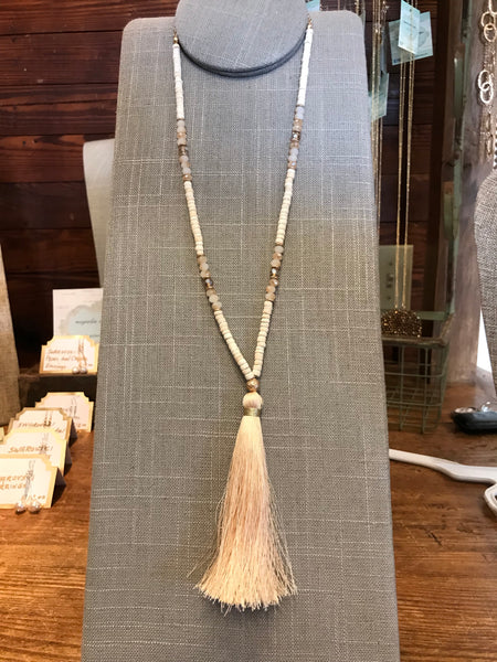 Wow! This 32 inch beaded tassel necklace adds the right icing to any top or dress. Available in Black, Grey, and Ivory.