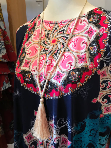 Wow! This 32 inch beaded tassel necklace adds the right icing to any top or dress. Available in Black, Grey, and Ivory.