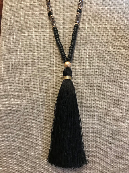 Wow! This 32 inch beaded tassel necklace adds the right icing to any top or dress. Available in Black, Grey, and Ivory.