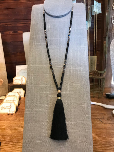 Wow! This 32 inch beaded tassel necklace adds the right icing to any top or dress. Available in Black, Grey, and Ivory.