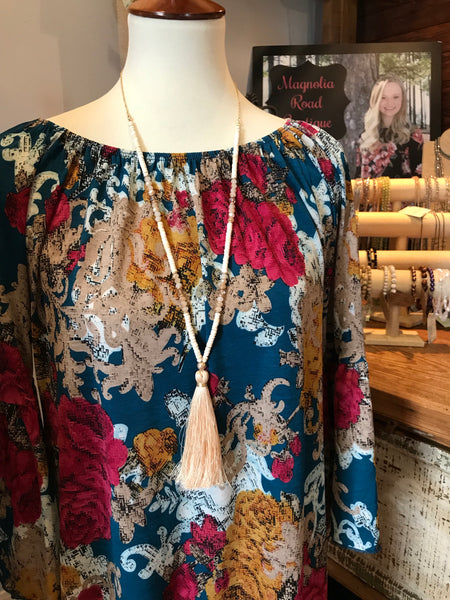 Wow! This 32 inch beaded tassel necklace adds the right icing to any top or dress. Available in Black, Grey, and Ivory.