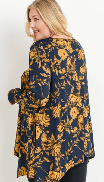 This is absolutely one of our favorite fabrics! This long sleeve round neckline top by JODIFL has a asymmetrical hem that covers all of the parts that need to be covered! The fabric is 100% polyester and just gorgeous. Available in 1X- 3X.