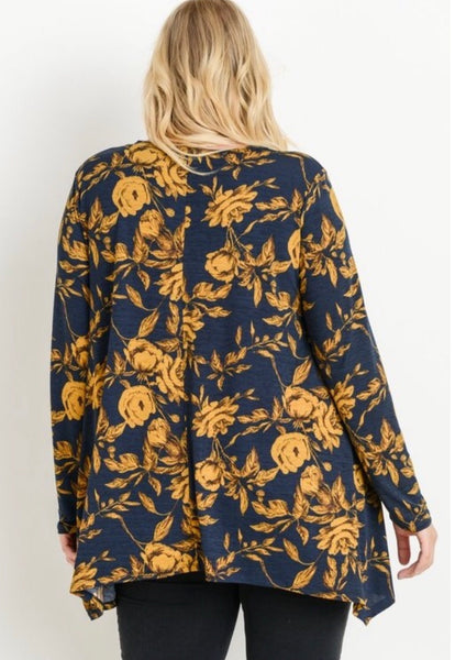 This is absolutely one of our favorite fabrics! This long sleeve round neckline top by JODIFL has a asymmetrical hem that covers all of the parts that need to be covered! The fabric is 100% polyester and just gorgeous. Available in 1X- 3X.