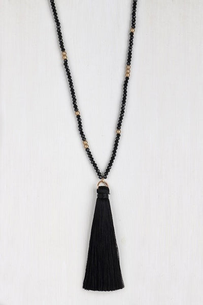 This lovely mixed glass necklace is brought to you by Urbanista. It is 32" long with a 3" extender and features a fine thread tassel pendant.