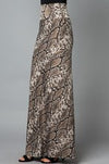 This on trend maxi skirt is by Lovely J. It features a long length, snake skin print, and a wide waist band for a flattering fit.  Comes in S-3X.