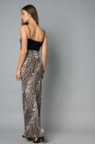 This on trend maxi skirt is by Lovely J. It features a long length, snake skin print, and a wide waist band for a flattering fit.  Comes in S-3X.
