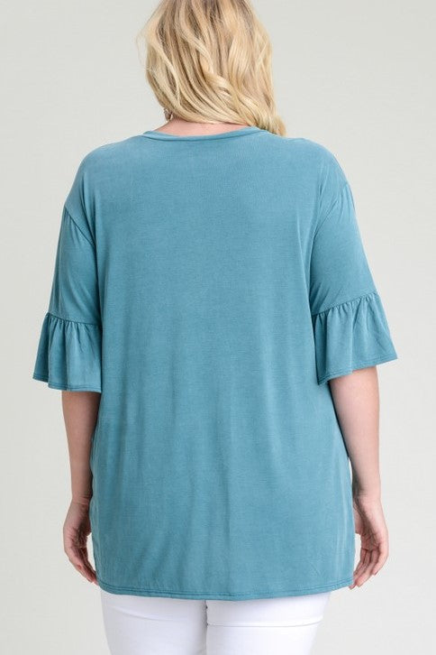 This lovely teal top from Jodifl features half trumpet sleeves and a twist from. Made of modal rayon. Comes in 1X - 3X.