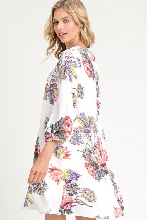 This beautiful floral dress from Jodifl features a pretty print, crisscross strappy V-neck, and 3/4 balloon sleeves. Comes in  S - L. 
