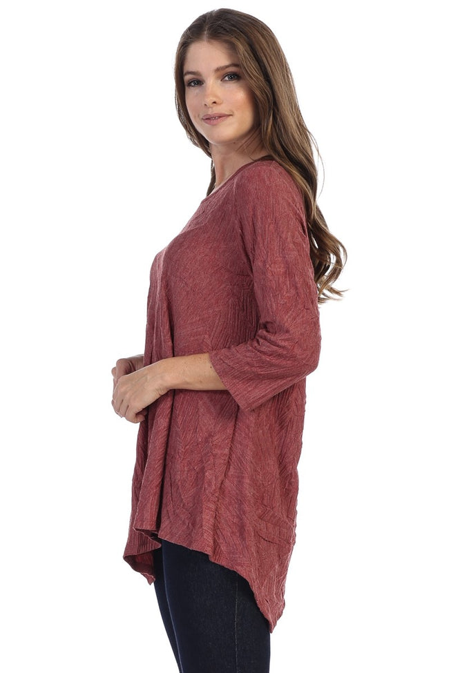 This awesome top is brought to you by Focus Fashion. It features 3/4 sleeves, an asymmetrical hemline, a round neckline, and a rayon/polyester blend. 