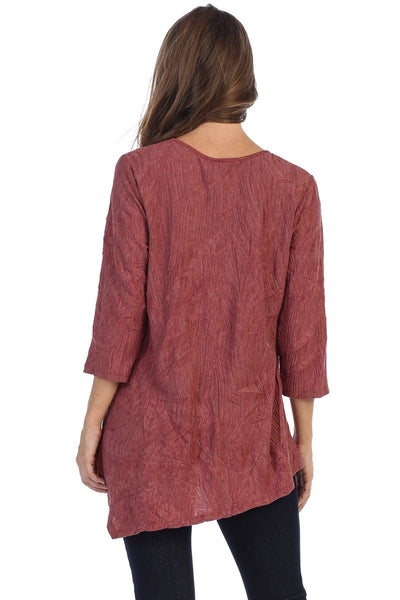 This awesome top is brought to you by Focus Fashion. It features 3/4 sleeves, an asymmetrical hemline, a round neckline, and a rayon/polyester blend. 