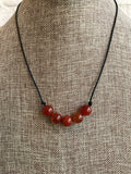 ﻿We love this natural orange fire agate custom leather necklace with our fall dresses and tops. Choose 17 or 19 inches. Custom designed and made by Dixie Klein. 