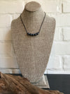 ﻿This 5 stone leather necklace features natural grey quartz. It's 18 inches. Dixie Klein custom designed and crafted for Magnolia Road Boutique. 