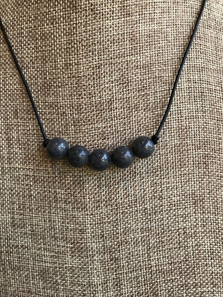 ﻿This 5 stone leather necklace features natural grey quartz. It's 18 inches. Dixie Klein custom designed and crafted for Magnolia Road Boutique. 