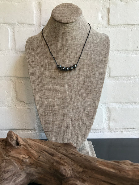 Grey - Classic and Timeless! This 19 inch leather and natural Hermatite necklace is a real beauty. It was designed by Magnolia Road Boutique's own Dixie Klein. 