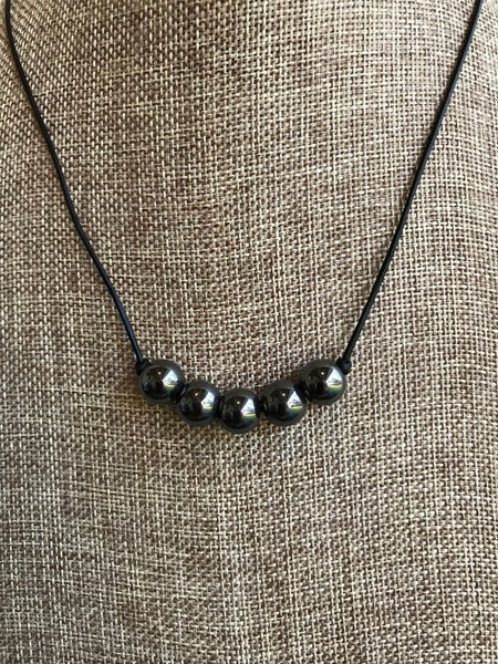 Grey - Classic and Timeless! This 19 inch leather and natural Hermatite necklace is a real beauty. It was designed by Magnolia Road Boutique's own Dixie Klein. 