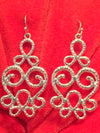 These beautiful scroll chandelier earrings compliment any outfit. They feature lovely scroll work and hang 1 and 3/4 inches. Available in silver and gold. 