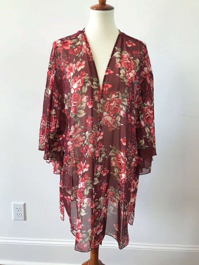 This burgundy floral cardigan from Honeyme is so versatile. Wear it over your favorite tank or t-shirt with jeans or shorts. It features a full cut and comes in curvy sizes 1X through 3X.