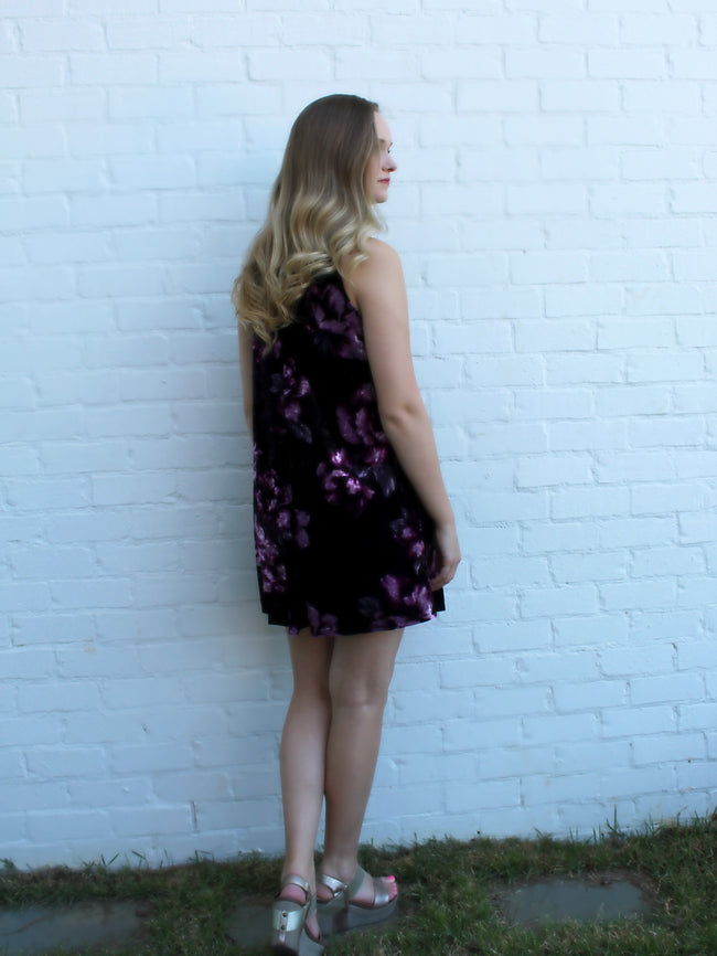 Feel great in the black and wine colored velvet dress perfect for a special occasion. The purple flowers and a peek-a-boo neckline looks elegant and current.