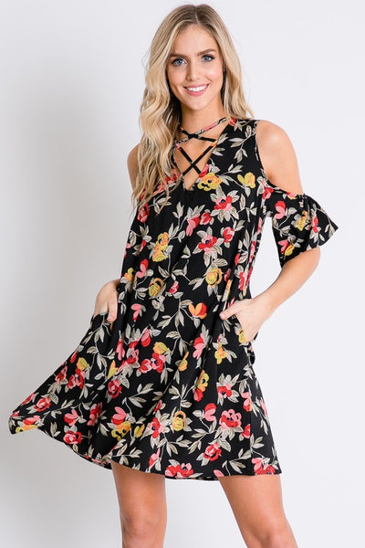 This floral print dress from Davi &Dani features cold shoulders and a cut out strap detailed neckline. Comes in S - L. 