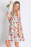 This floral print dress from Davi &Dani features cold shoulders and a cut out strap detailed neckline. Comes in S - L. 