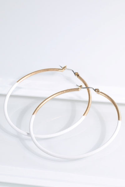 Have some fun wearing these two tone earrings from Urbanista that come in Gold/White or Gold/Black and hang 2 1/4". 