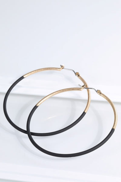 Have some fun wearing these two tone earrings from Urbanista that come in Gold/White or Gold/Black and hang 2 1/4". 