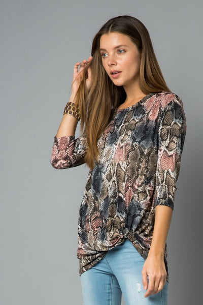 This gorgeous multi-colored snake print top from Lovely J features beautiful colors, 3/4 sleeves, and a twist front. Comes in S - 3XL.
