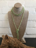 ﻿So in and so versatile! This light sage green necklace is 72 inches long and best of all....hand knotted with matching thread. The crystal beads are faceted giving this necklace sparkle. Wear it long, wrap it once for choker look or even three times! This will be one you wear over and over.