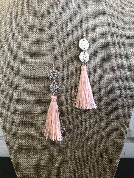 Pretty in rose gold and pink tassel earrings! Two rose gold hammered disks with a light pink threaded tassel. Total length is 3 inches.  