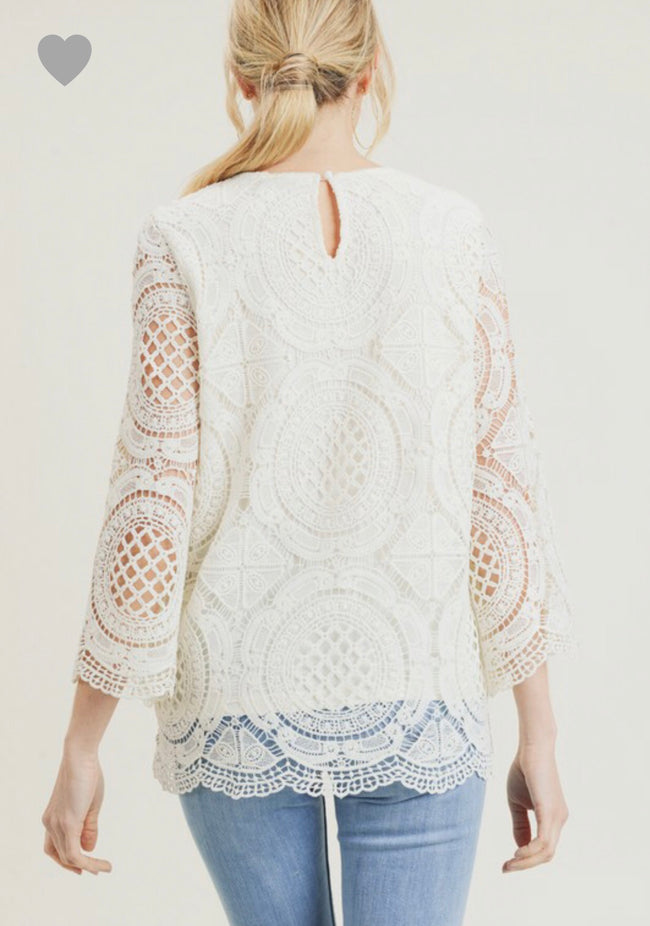Our Jodifl tops are in demand! This one is gorgeous and a new favorite for Spring! This beautiful crochet top has three quarter sleeves and a scalloped edge. Non-shear lined body and shear sleeves. Comes in cream, black and kale. 