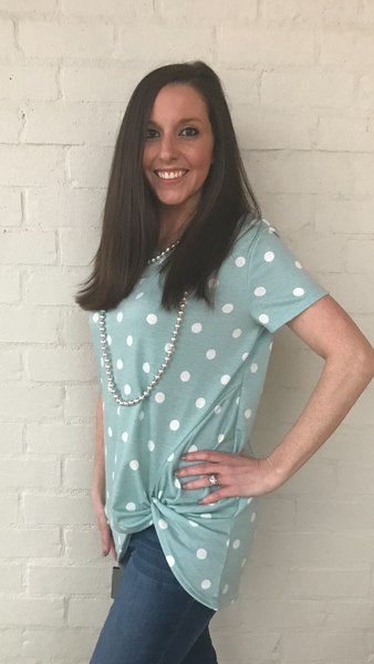 Polka Dot Front Knotted Tunic Top. Perfect for a fun loving, day out. 85% polyester 10% rayon 5% spandex.