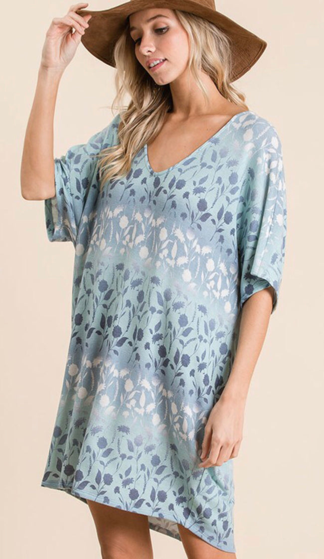 Ces Femme has created this versatile floral and ombré dolman sleeve loose fit knit dress! It features short dolman sleeves and a v-neck. Wear it with your favorite sandals.  Perfect for a beach cover-up too!  Comes in blue or soft pink.  100% polyester.    Fits loose: Small 2/4, Medium 6/8, Large 10/12