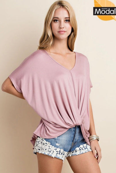 New ee:some tops are in just in time for the Spring! This one is features super soft Modal fabric and a deep v-neck and twist tie front.  Super cut to wear with leggings, jeans or shorts!  and has self ties on the three quarter length sleeves. It comes in pretty blush or black.  Comes in Small- Large 96% Rayon 4% Spandex Made in the USA