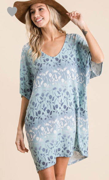 Ces Femme has created this versatile floral and ombré dolman sleeve loose fit knit dress! It features short dolman sleeves and a v-neck. Wear it with your favorite sandals.  Perfect for a beach cover-up too!  Comes in blue or soft pink.  100% polyester.    Fits loose: Small 2/4, Medium 6/8, Large 10/12