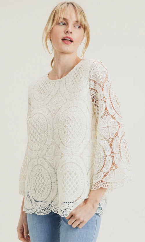 Our Jodifl tops are in demand! This one is gorgeous and a new favorite for Spring! This beautiful crochet top has three quarter sleeves and a scalloped edge. Non-shear lined body and shear sleeves. Comes in cream, black and kale. 