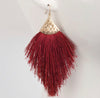   We love this fabulous fringe earring with fine threads! These earrings make a statement! 3.5x2 inches. Comes in Grey or Burgundy.   